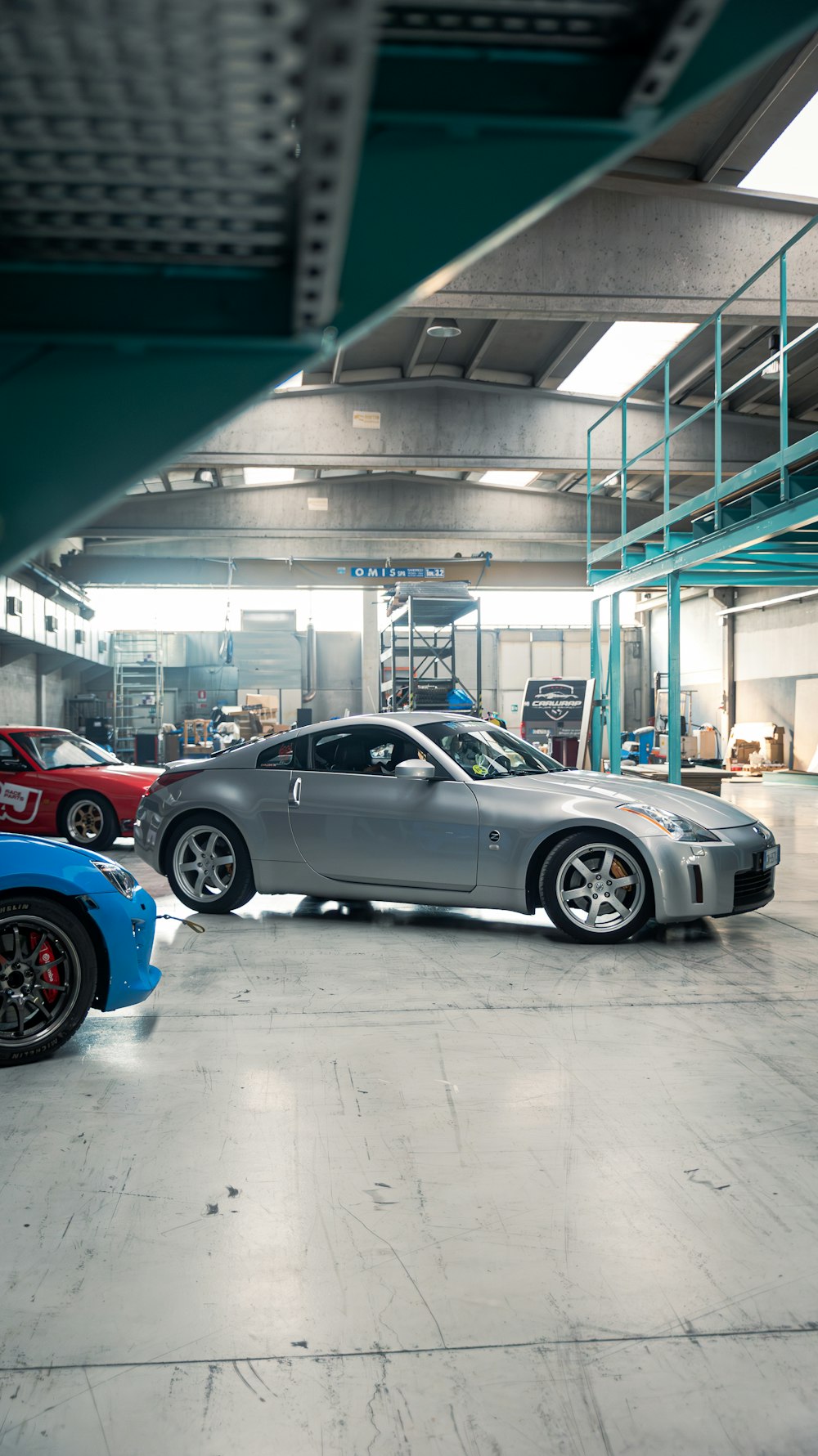 a couple of cars that are parked in a garage