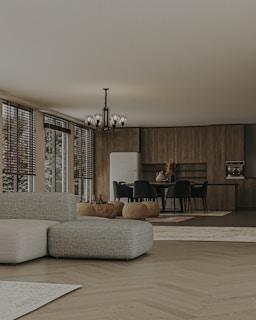 Spacious kitchen area highlighting durable vinyl flooring and sleek blackout blinds on large windows.