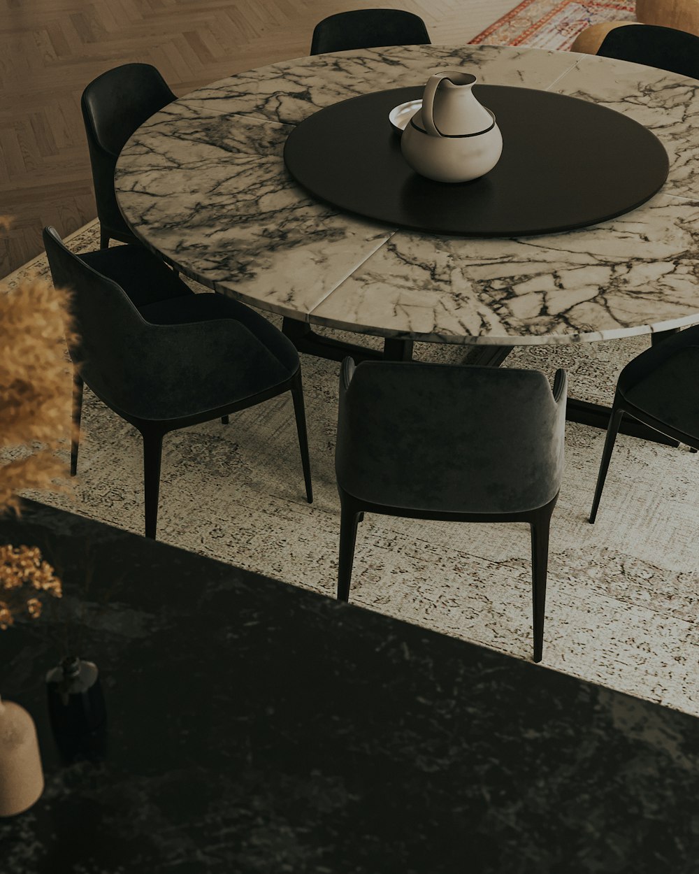 a marble dining table with chairs around it