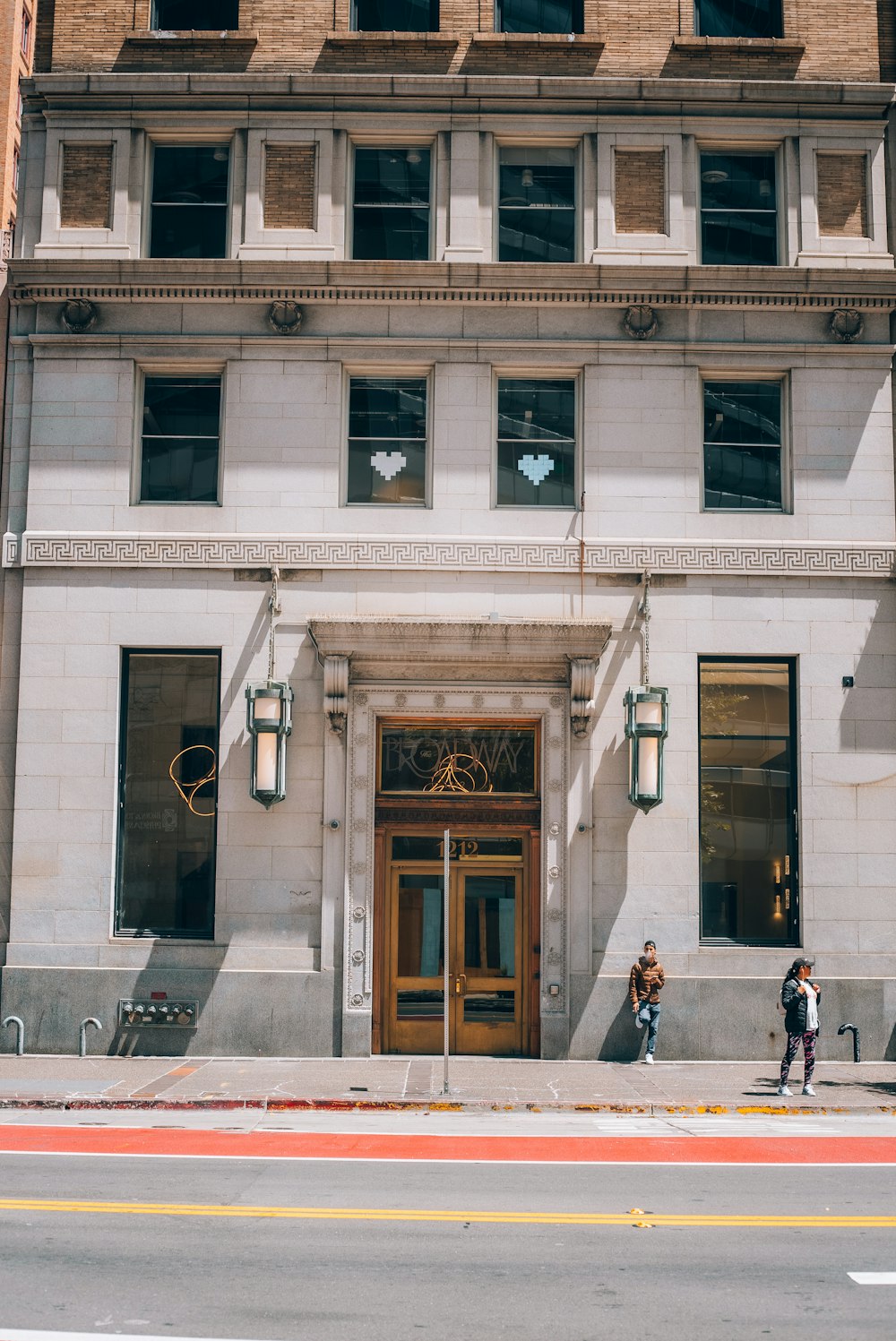 a couple of people standing in front of a building