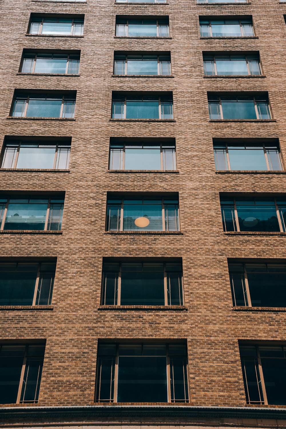 a tall brick building with lots of windows