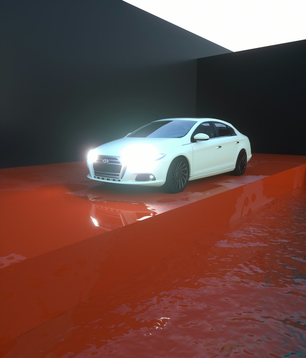 a white car parked on top of a red floor