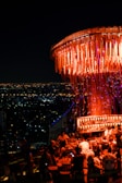 A stylish rooftop party with a beautiful city view.