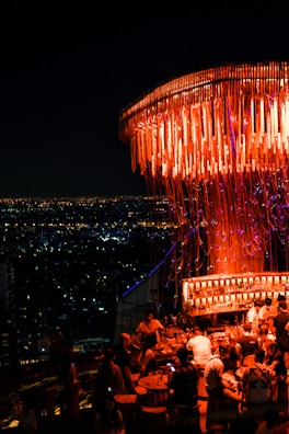 A stylish rooftop party with a beautiful city view.