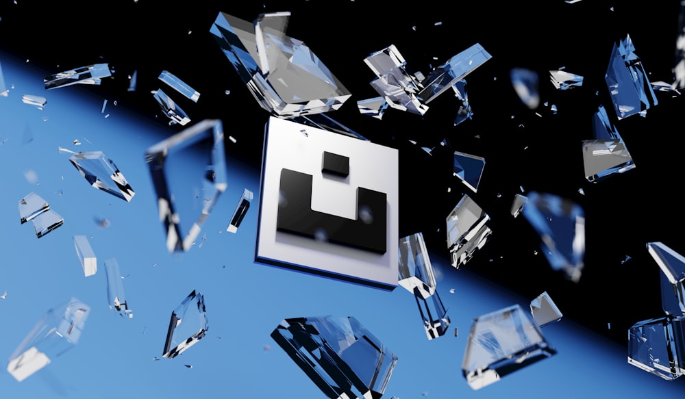 a white cube with a black face surrounded by crystal cubes