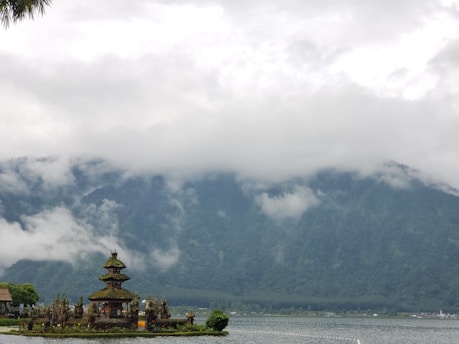 A serene Tibetan Buddhist temple surrounded by nature.