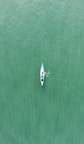 a person in a kayak in the middle of a body of water