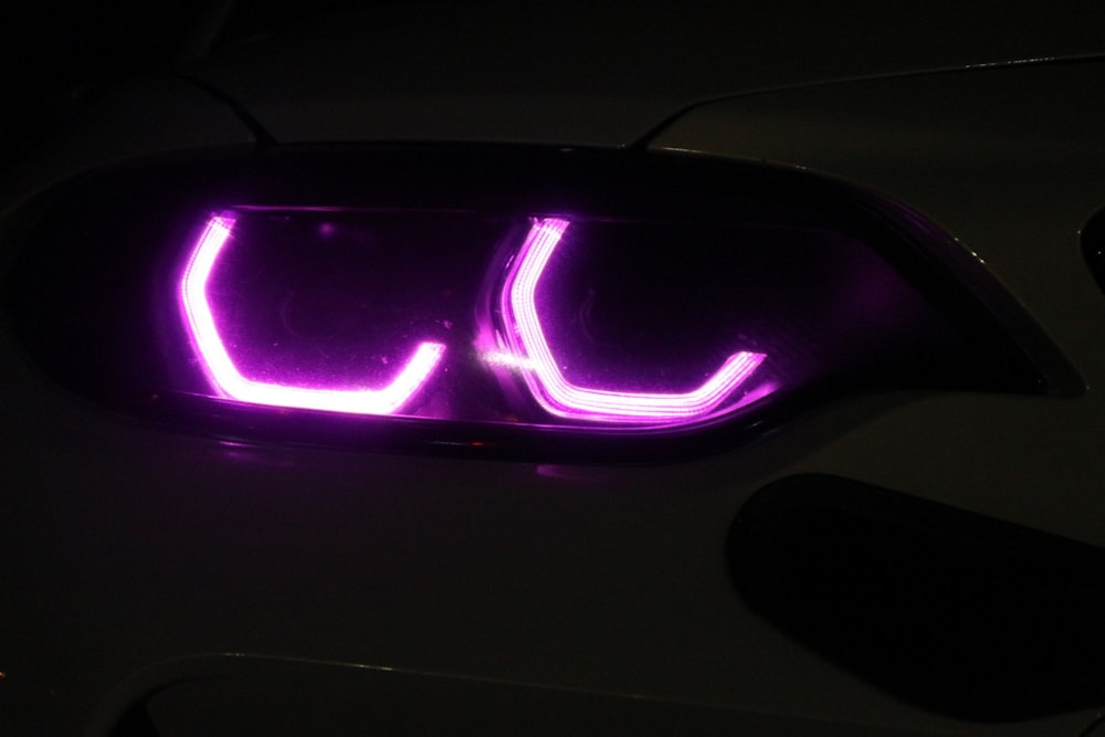 a close up of a car with a purple light