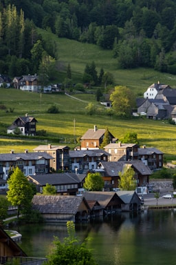 A serene village landscape showcasing traditional houses and greenery.