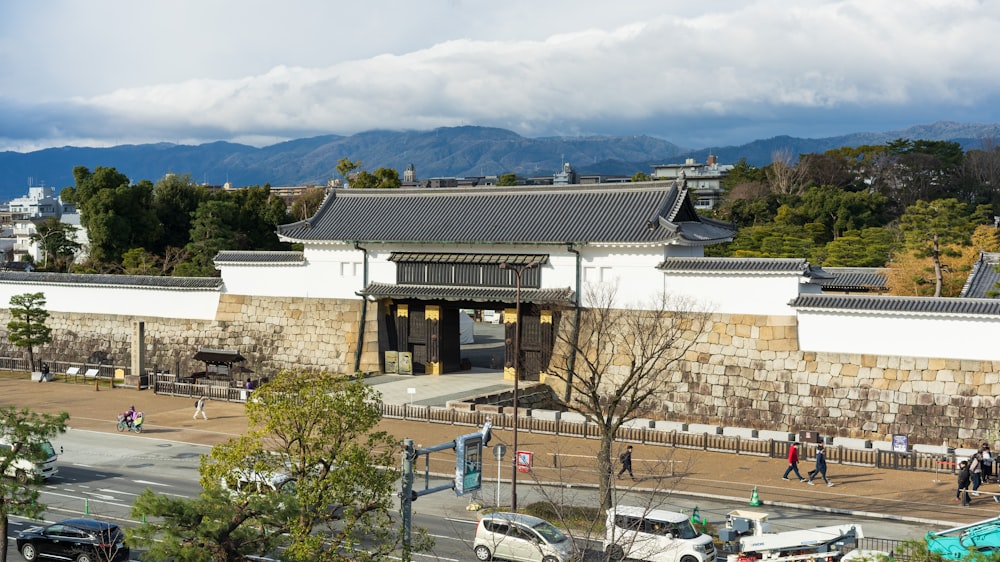 a view of a building with a lot of cars parked in front of it