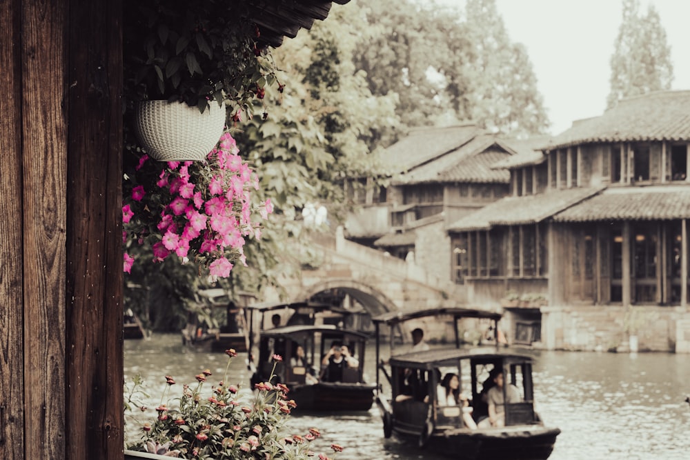 a group of boats floating on top of a river