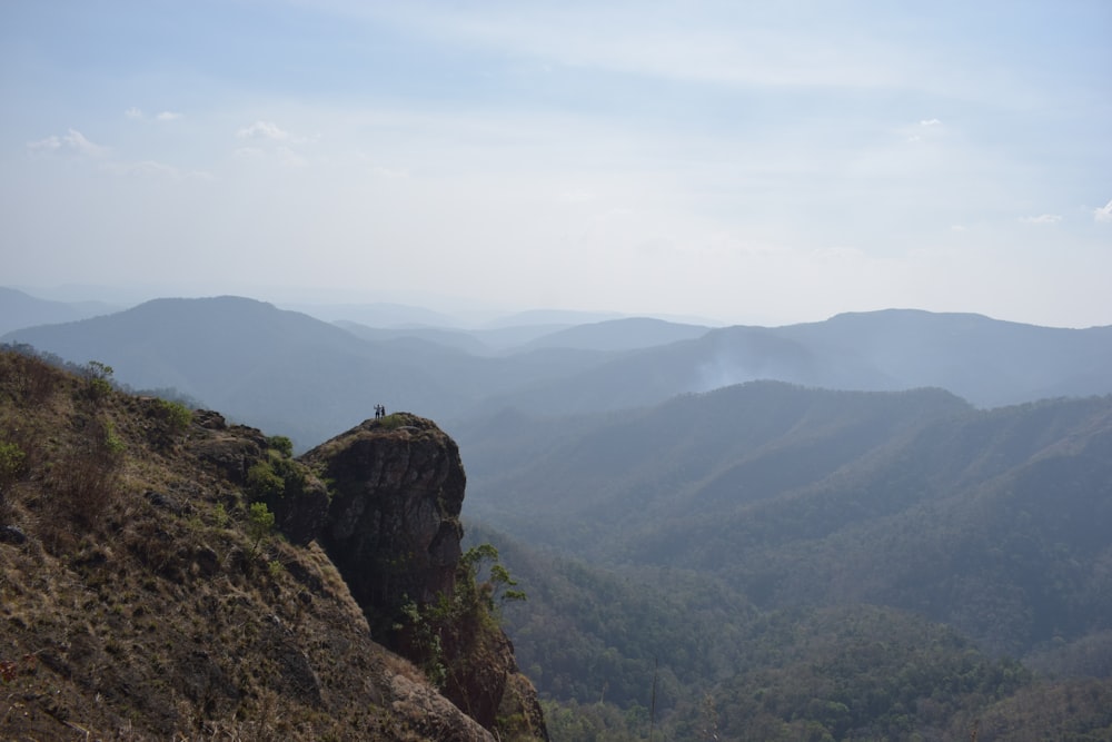 a view of the mountains from a high cliff