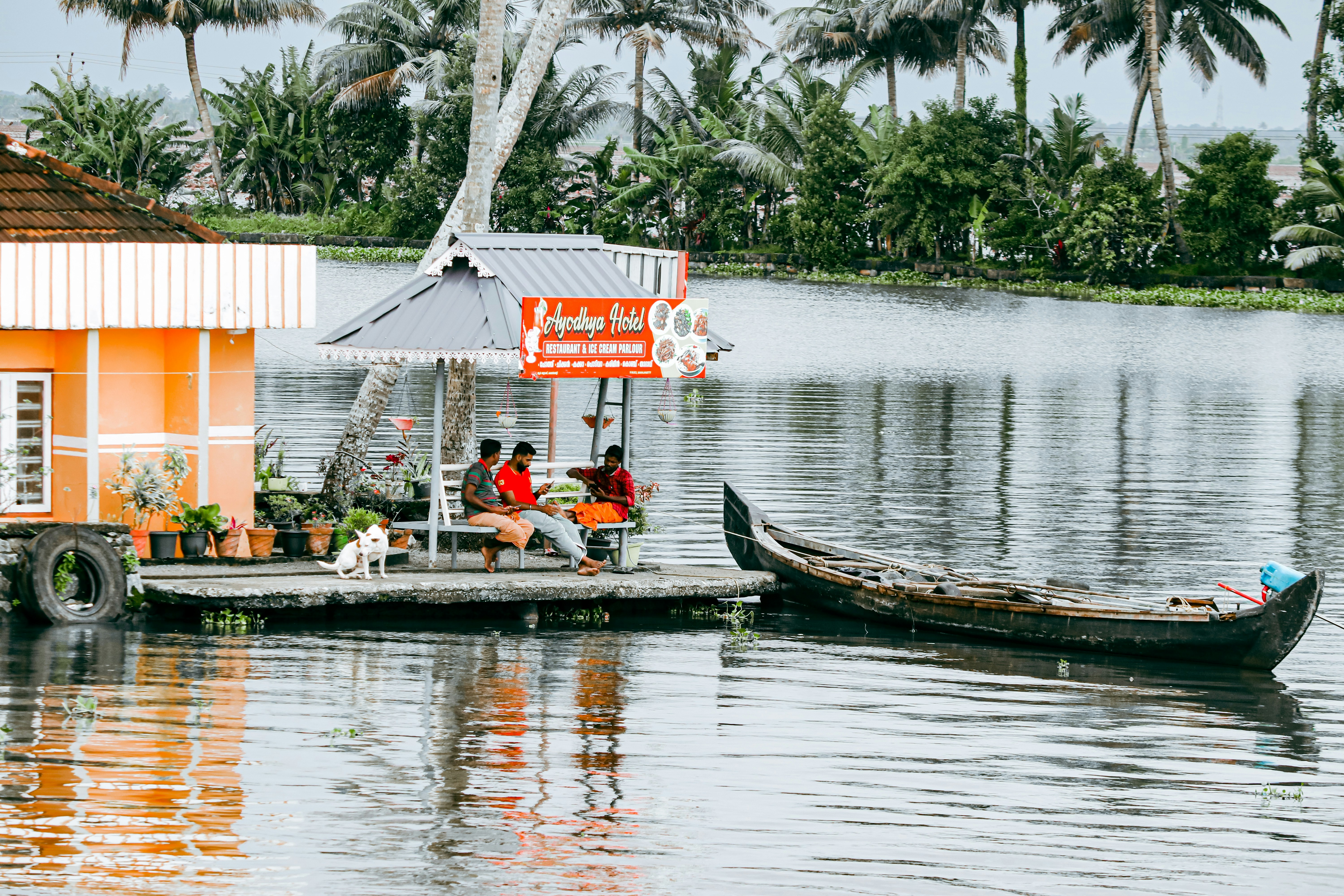 a couple of boats floating on top of a lake