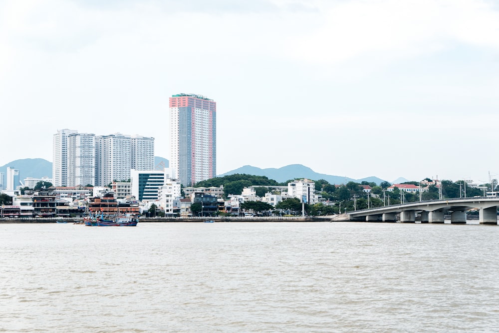 a large body of water with a city in the background