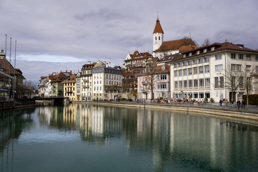 a river running through a city next to tall buildings