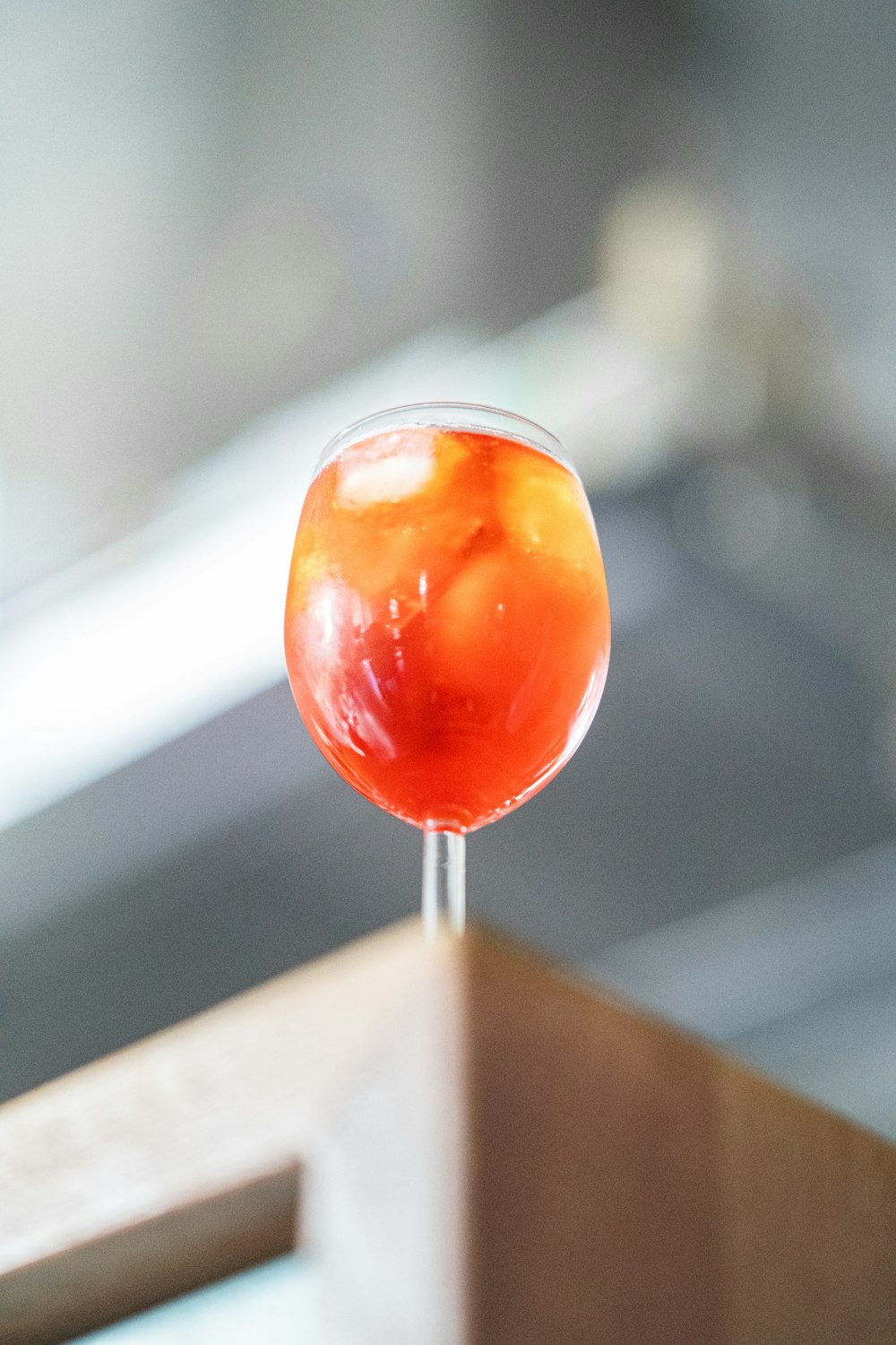 a close up of a wine glass on a table