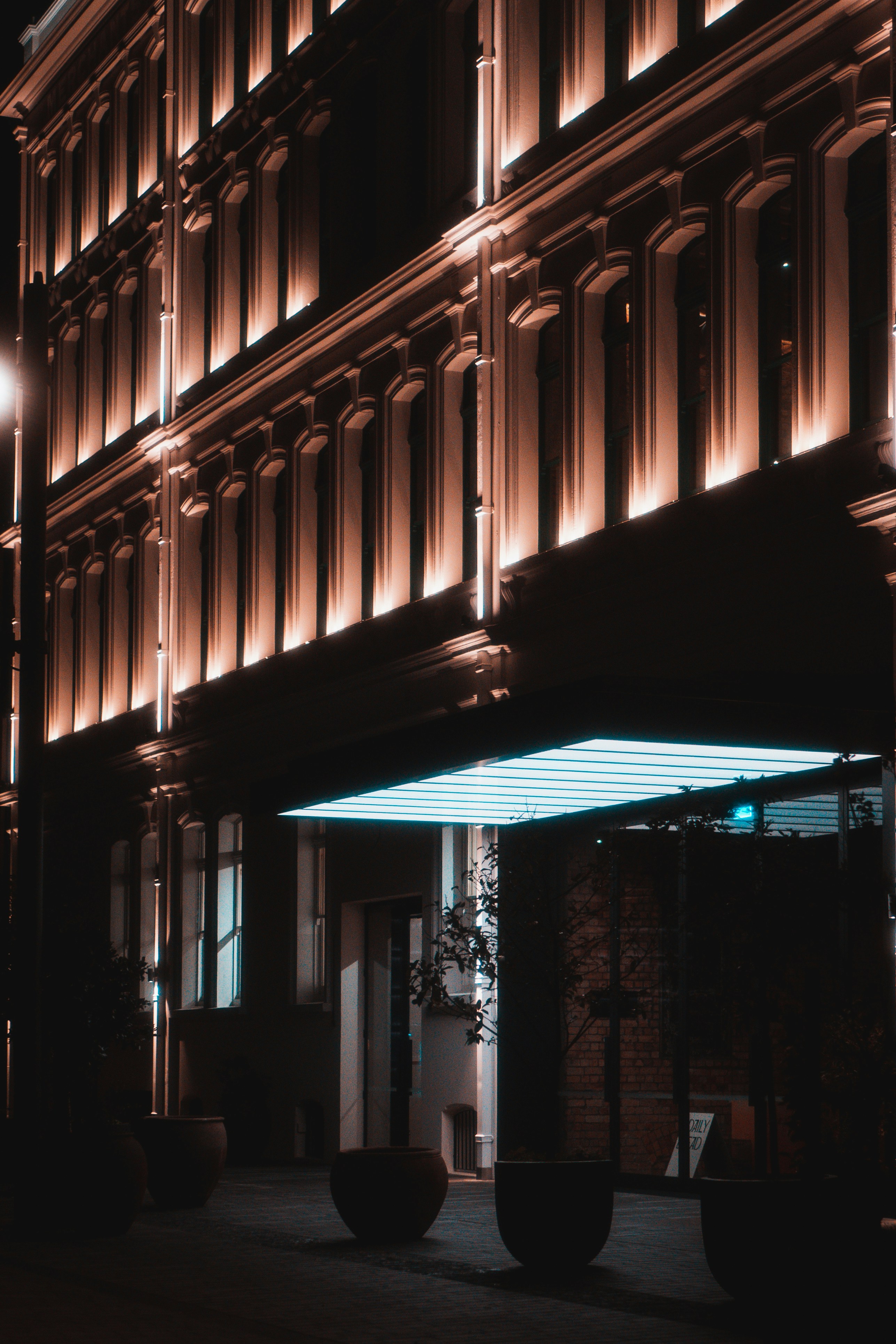 a building with a lit up entrance at night