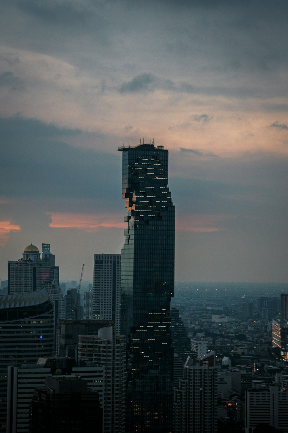 a very tall building towering over a city