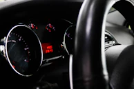 Close-up of a car odometer with suspicious mileage highlighted.