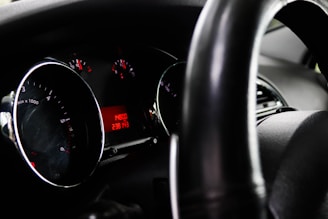 Close-up of a car dashboard showing low mileage and well-maintained interior.