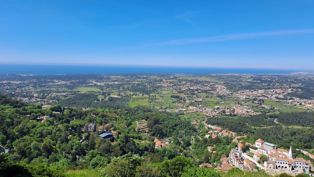 a scenic view of a town and a body of water