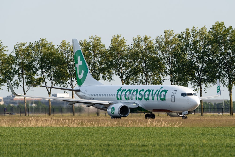 a large passenger jet sitting on top of an airport runway