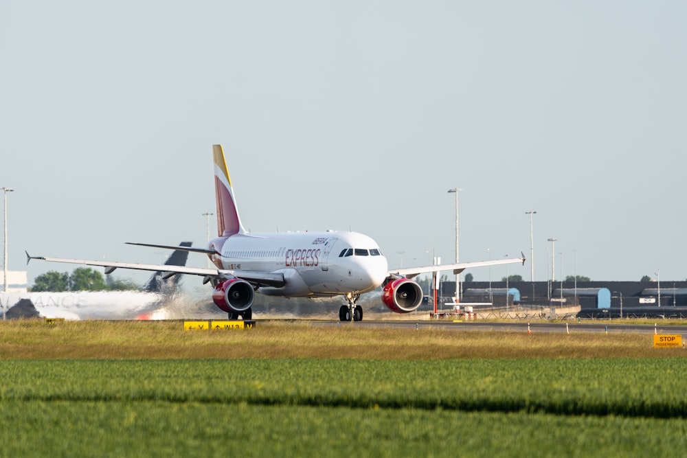 a large jetliner sitting on top of an airport runway