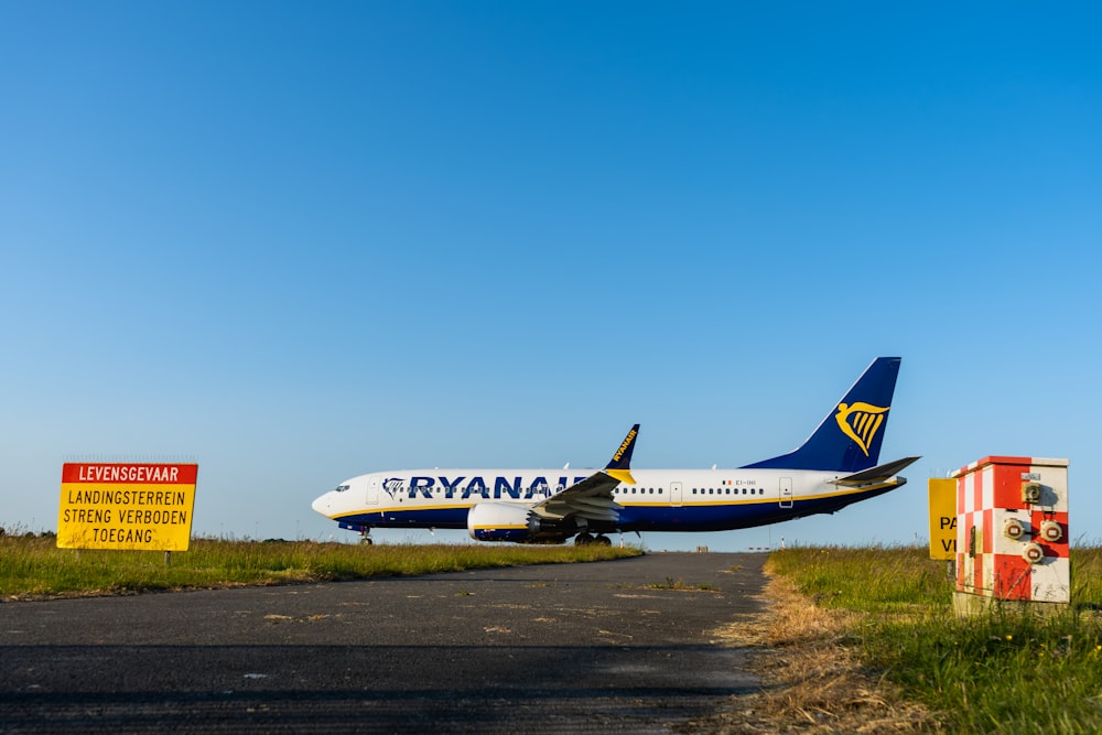 a large jetliner sitting on top of an airport runway