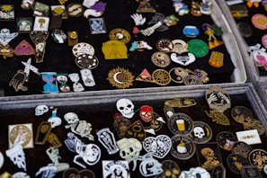 An assortment of accessories including pins and bags that reflect pride in the Black American experience.