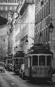 Historic black-and-white photo of downtown Atlanta with early 20th-century streetcars.
