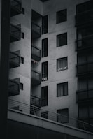 A modern apartment building with large balconies and views.