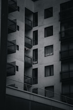 Modern apartment building with balconies and city views.