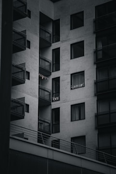 Modern apartment building with balconies and city view.