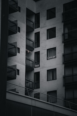 Modern apartment building with balconies and city view.