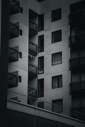 A modern apartment building with large balconies and views.