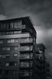 A modern high-rise condo with large windows overlooking the city skyline.