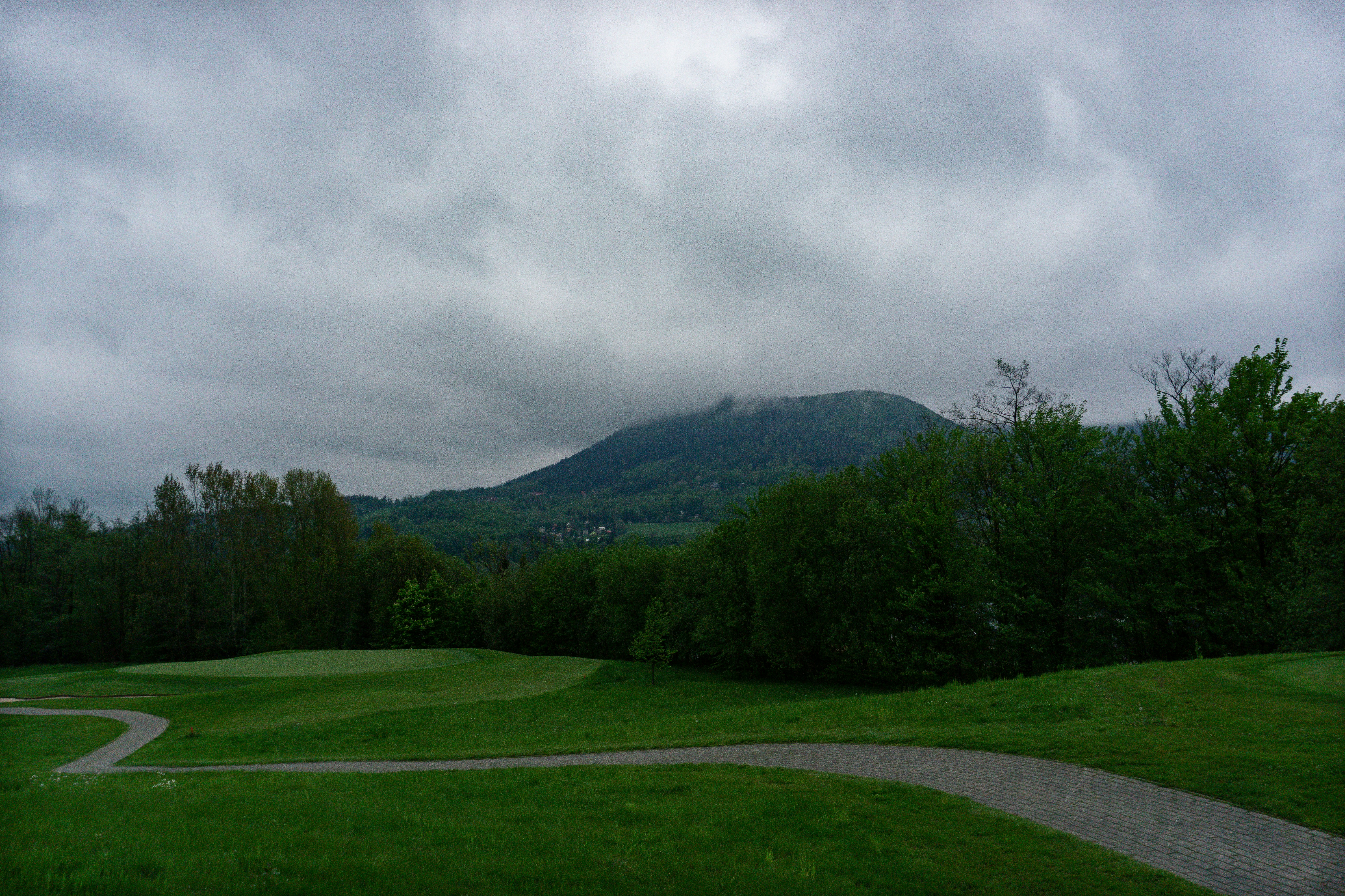 Golf course with mountainous terrain