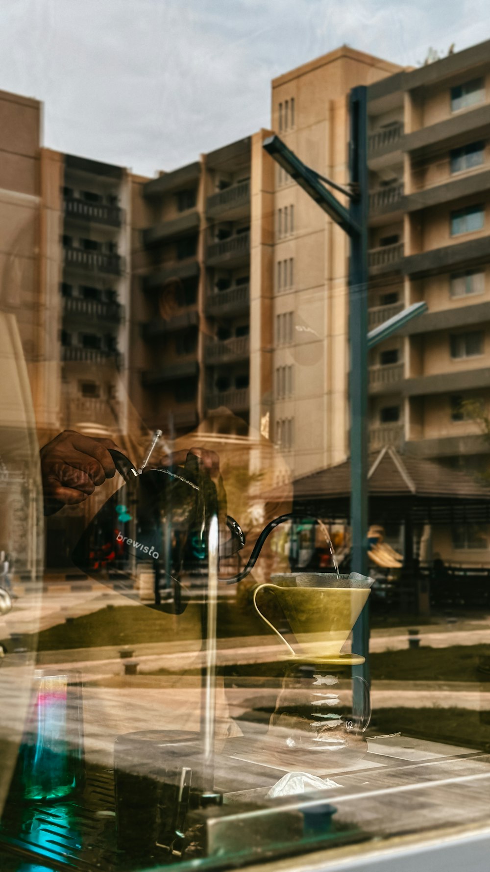 the reflection of a building in a window