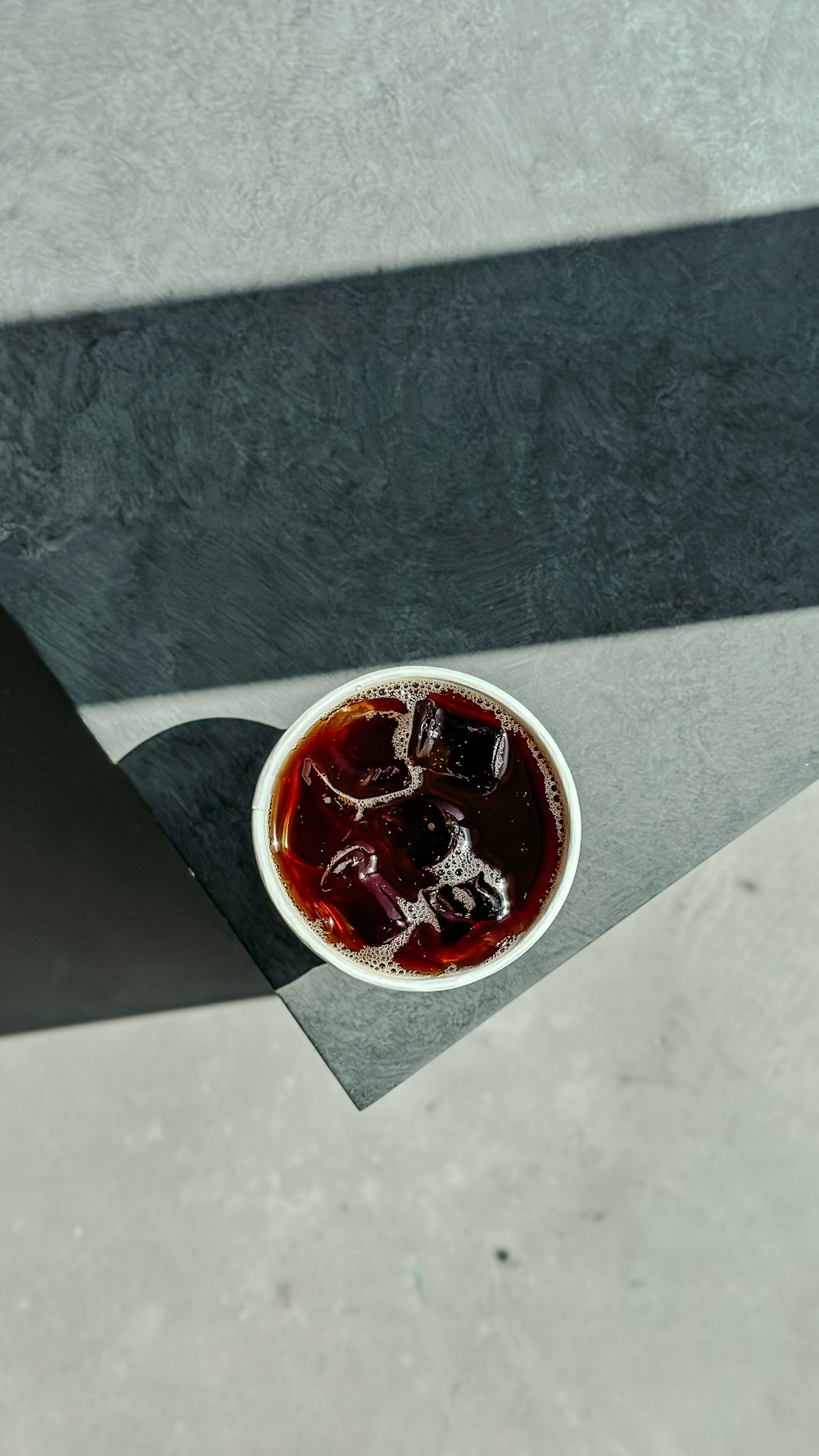 a cup of liquid sitting on top of a table