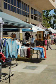 a group of people shopping at a flea market