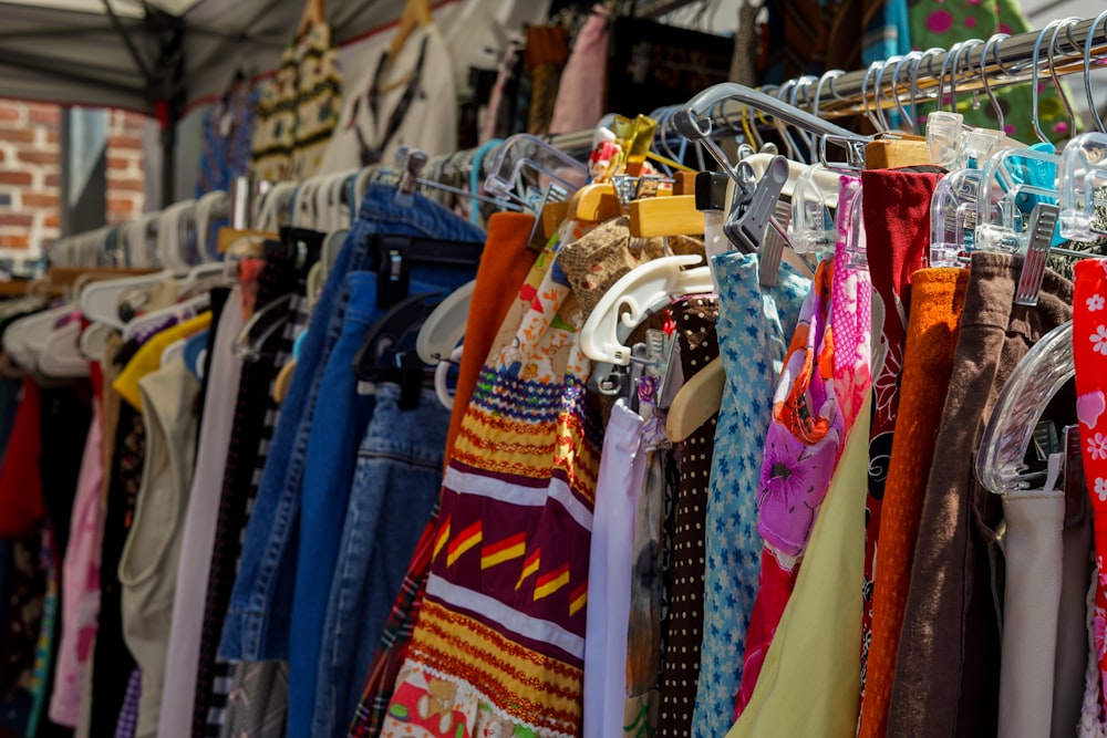 a rack of clothing hanging on a clothes line