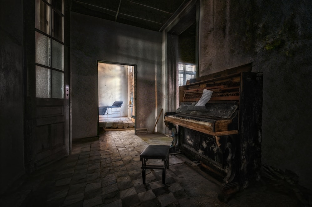 a room with a piano and a chair in it