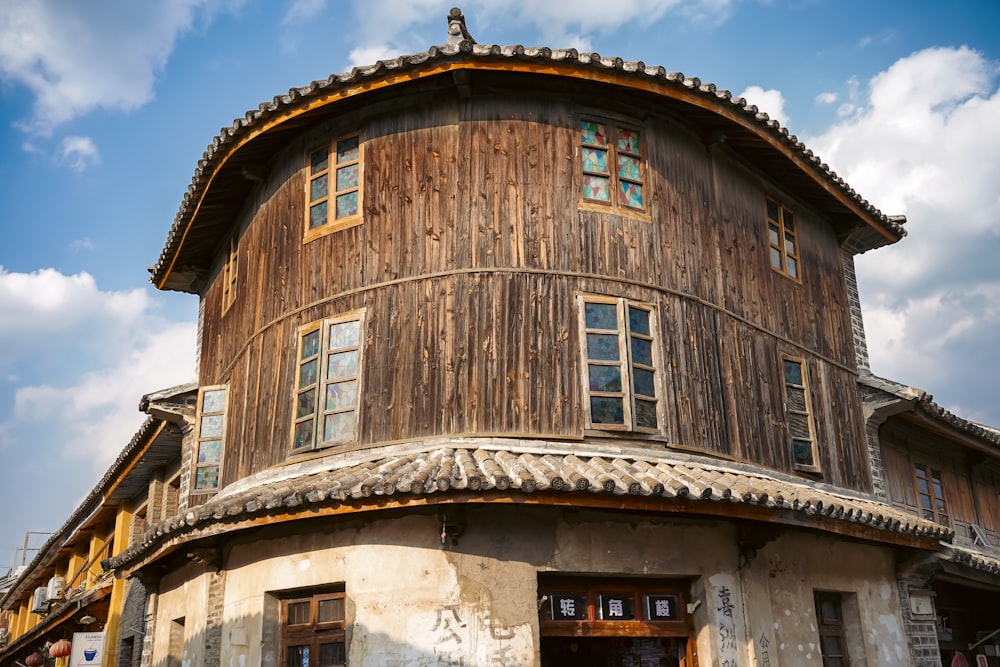 a round building with a wooden roof and windows