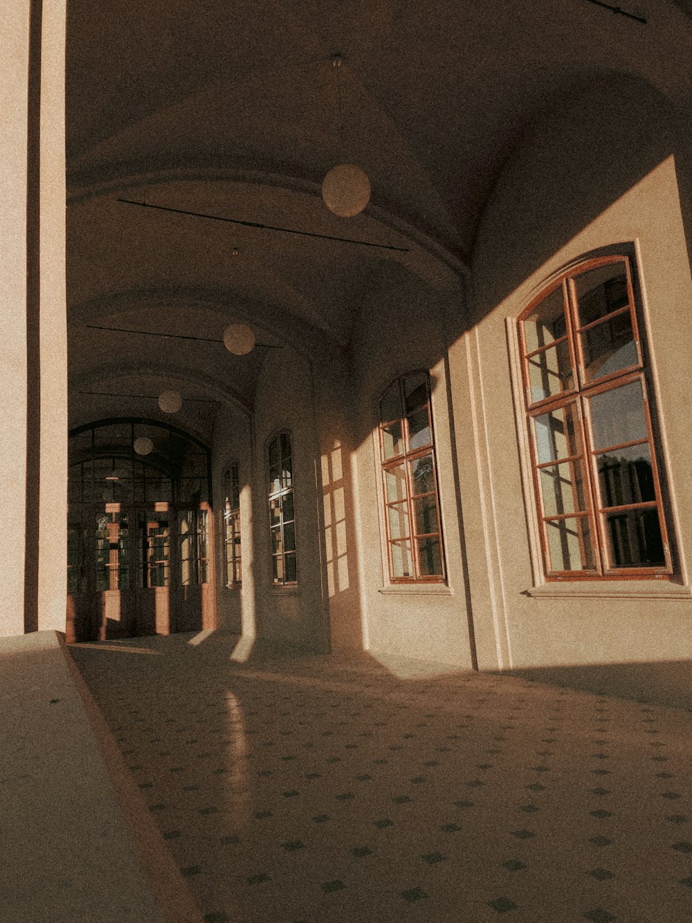 a long hallway with a clock on the wall