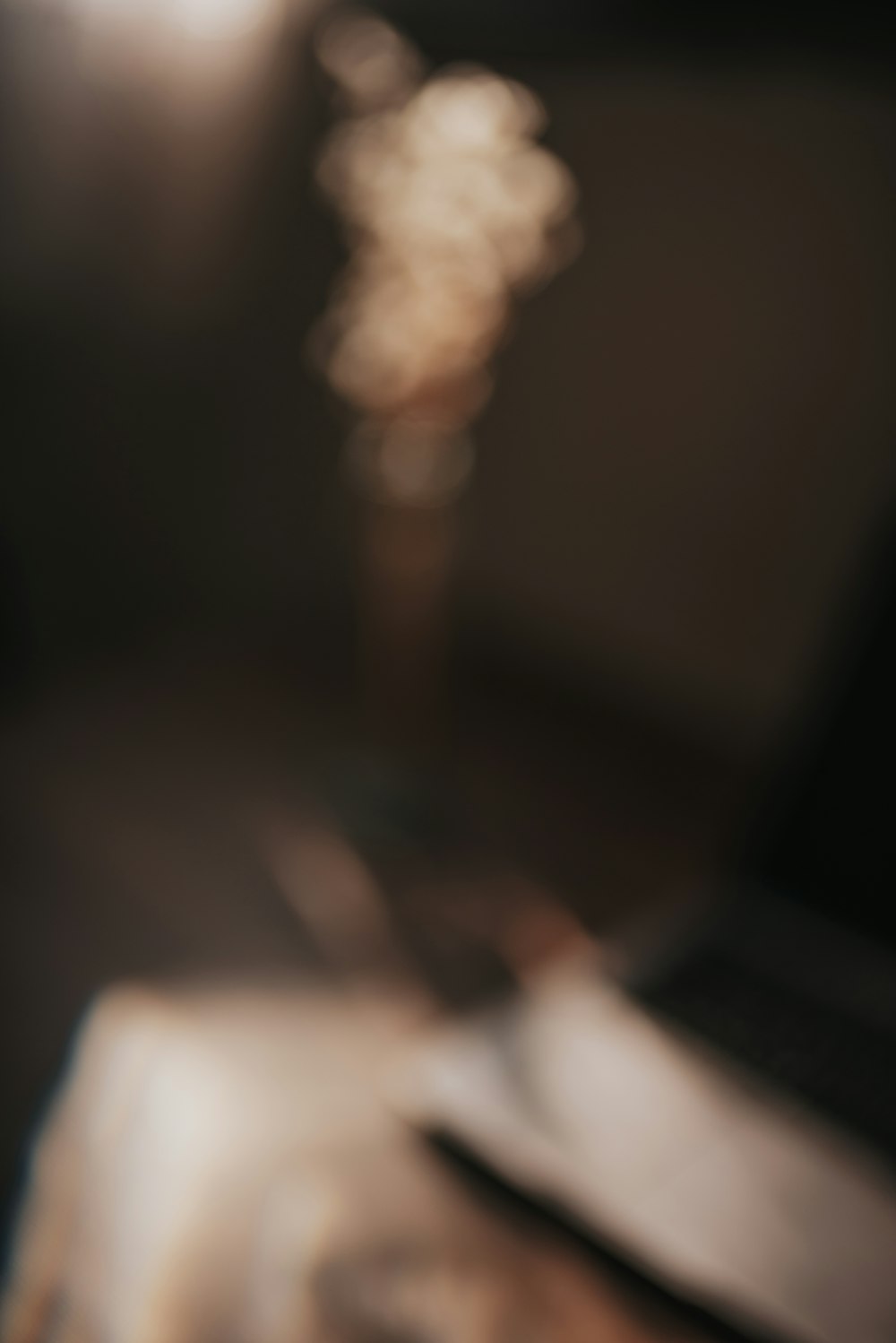 a blurry photo of a laptop computer on a desk