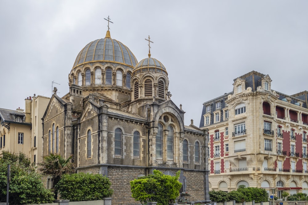 a large church with a steeple on a cloudy day