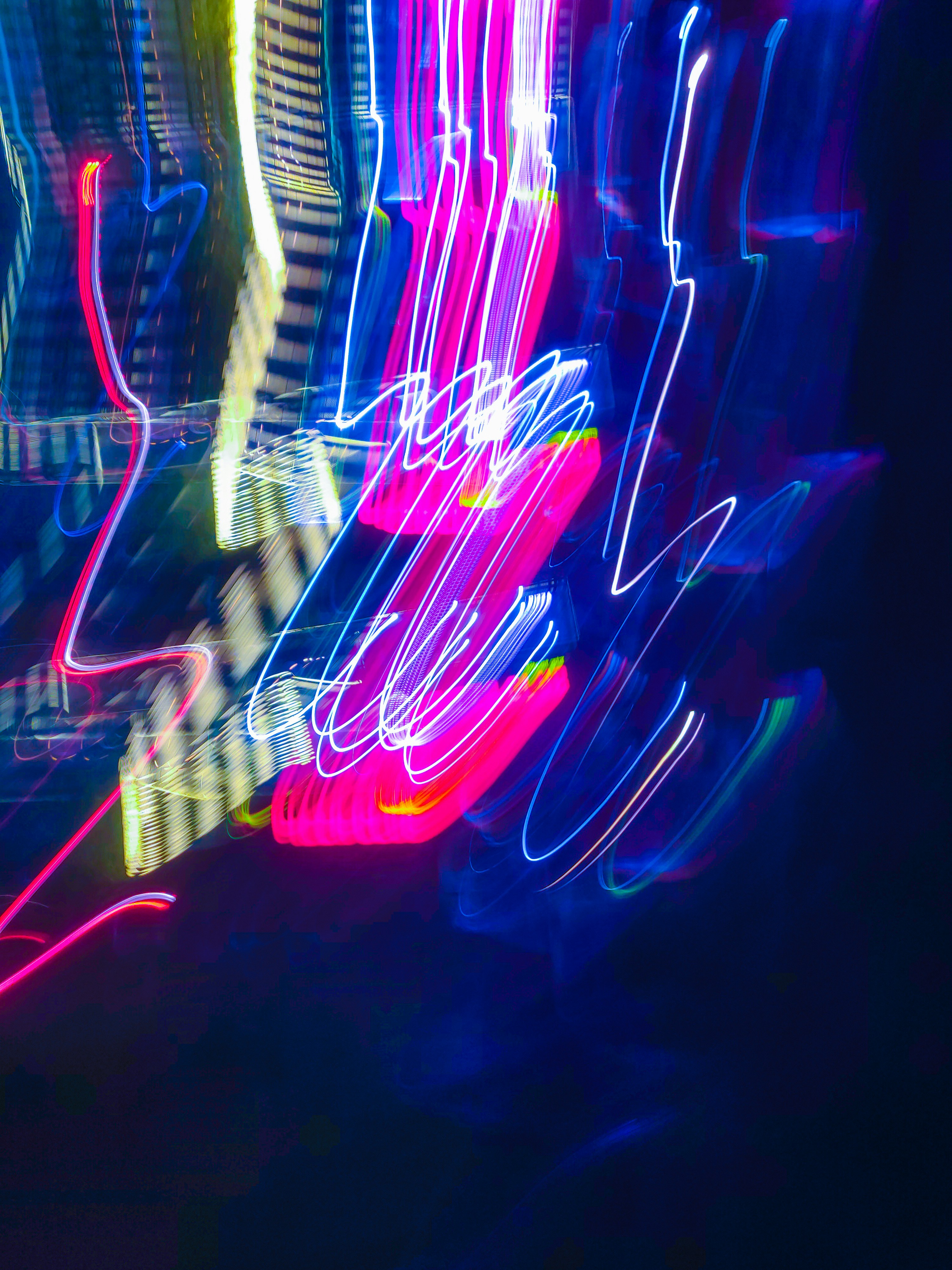 Abstract neon light trails on dark background
