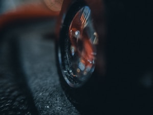 A close-up of a car tire gripping a wet road surface.