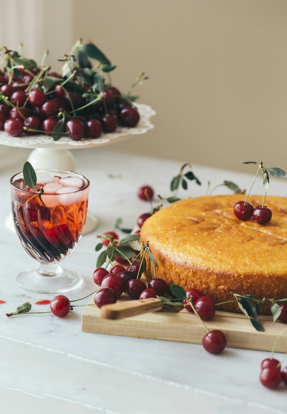 a cake and a glass of wine on a table