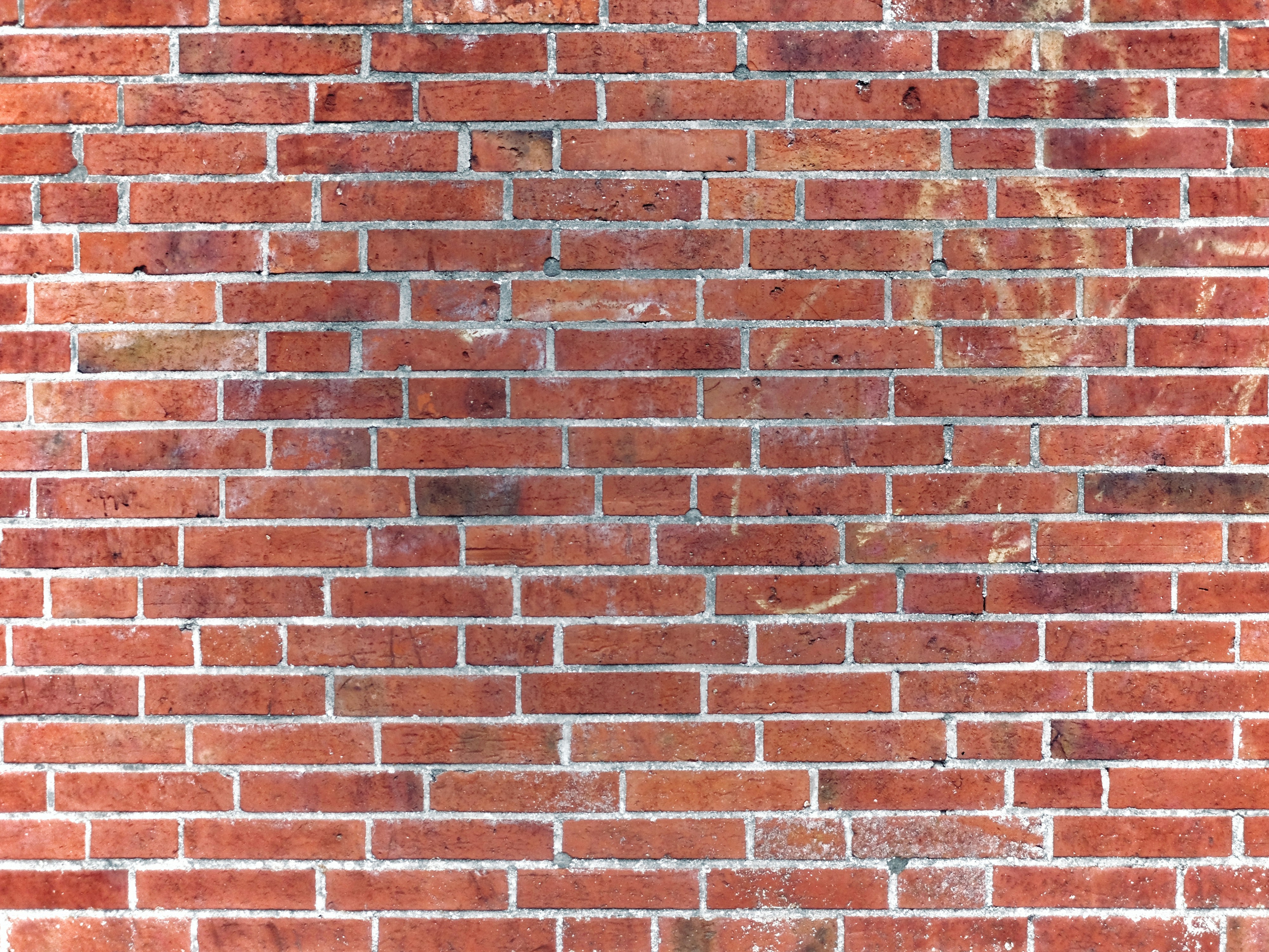 a close up of a red brick wall